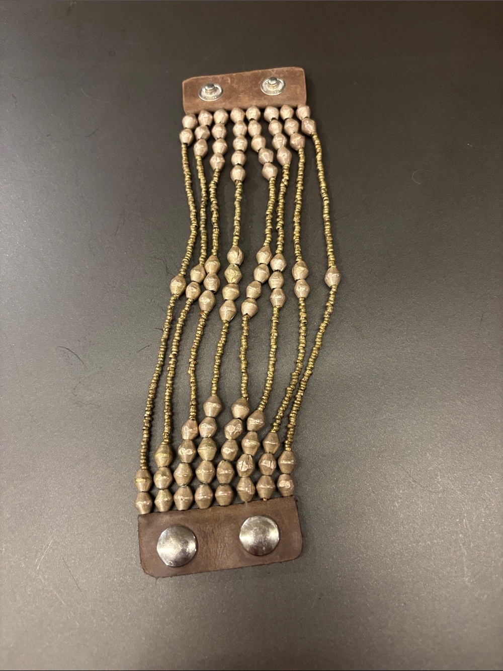 Noonday gold metal Beaded Multi-Strand Bracelet with leather. Handmade.